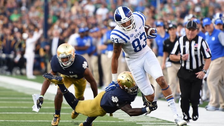 SOUTH BEND, IN – SEPTEMBER 24: Anthony Nash #83 of the Duke Blue Devils is tripped up by Daelin Hayes #9 of the Notre Dame Fighting Irish during the second half of a game at Notre Dame Stadium on September 24, 2016 in South Bend, Indiana. Duke defeated Notre Dame 38-35. (Photo by Stacy Revere/Getty Images)