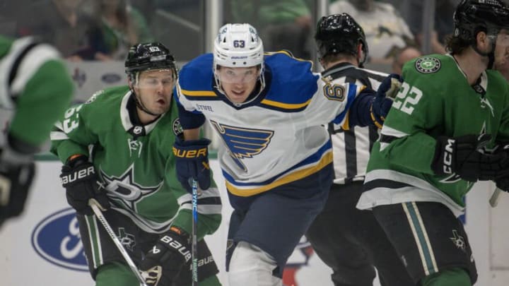 Oct 5, 2023; Dallas, Texas, USA; Dallas Stars right wing Evgenii Dadonov (63) and St. Louis Blues left wing Jake Neighbours (63) chase the puck in the neutral zone during the first period at the American Airlines Center. Mandatory Credit: Jerome Miron-USA TODAY Sports