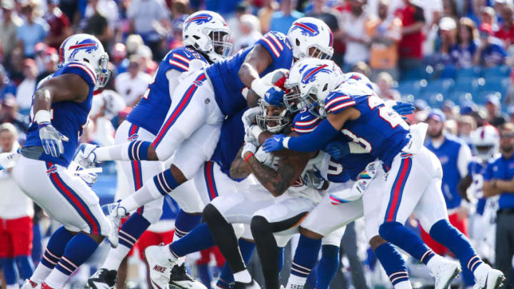 ORCHARD PARK, NY - OCTOBER 22: Mike Evans #13 of the Tampa Bay Buccaneers is tackled by the Buffalo Bills defense during the first quarter of an NFL game on October 22, 2017 at New Era Field in Orchard Park, New York. (Photo by Tom Szczerbowski/Getty Images)