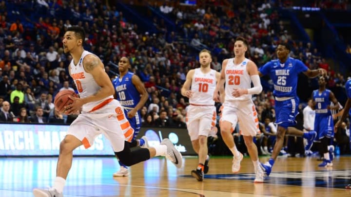 Mar 20, 2016; St. Louis, MO, USA; Syracuse Orange forward Michael Gbinije (0) leads the way up court for a shot during the second half of the second round against the Middle Tennessee Blue Raiders in the 2016 NCAA Tournament at Scottrade Center. Syracuse won 75-50. Mandatory Credit: Jeff Curry-USA TODAY Sports