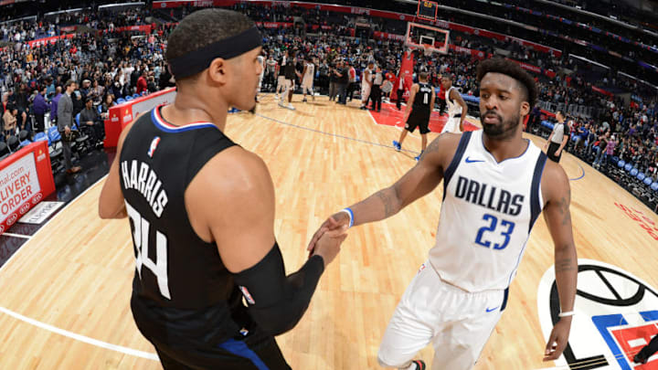 LOS ANGELES, CA - FEBRUARY 5: Tobias Harris #34 of the Wesley Matthews #23 of the Dallas Mavericks exchange handshakes after the game between the two teams on February 5, 2018 at STAPLES Center in Los Angeles, California. NOTE TO USER: User expressly acknowledges and agrees that, by downloading and/or using this Photograph, user is consenting to the terms and conditions of the Getty Images License Agreement. Mandatory Copyright Notice: Copyright 2018 NBAE (Photo by Andrew D. Bernstein/NBAE via Getty Images)