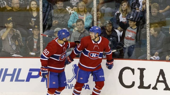 BATHURST, NEW BRUNSWICK - SEPTEMBER 18: Alex Belzile #60 of the Montreal Canadiens celebrates his goal agains the Florida Panthers with teammate Ryan Poehling #25 during the third period at the K.C. Irving Regional Centre on September 18, 2019 in Bathurst, New Brunswick, Canada. (Photo by Dave Sandford/NHLI via Getty Images)