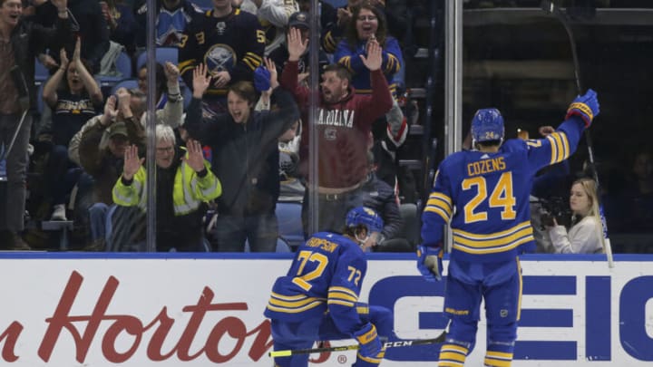 BUFFALO, NEW YORK - DECEMBER 01: Tage Thompson #72 and Dylan Cozens #24 of the Buffalo Sabres celebrate after Thompson scored a goal during the first period of an NHL hockey game against the Colorado Avalanche at KeyBank Center on December 01, 2022 in Buffalo, New York. (Photo by Joshua Bessex/Getty Images)