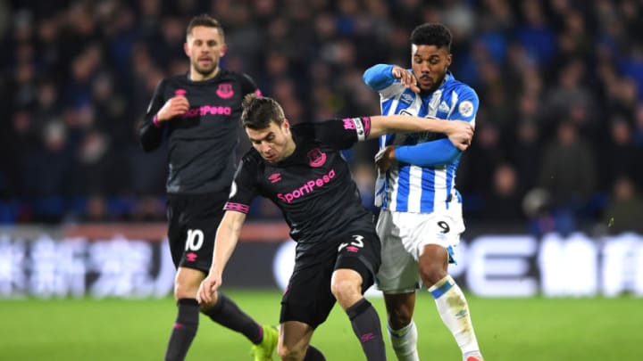 HUDDERSFIELD, ENGLAND - JANUARY 29: Seamus Coleman of Everton is challenged by Elias Kachunga of Huddersfield Town during the Premier League match between Huddersfield Town and Everton at John Smith's Stadium on January 29, 2019 in Huddersfield, United Kingdom. (Photo by Gareth Copley/Getty Images)