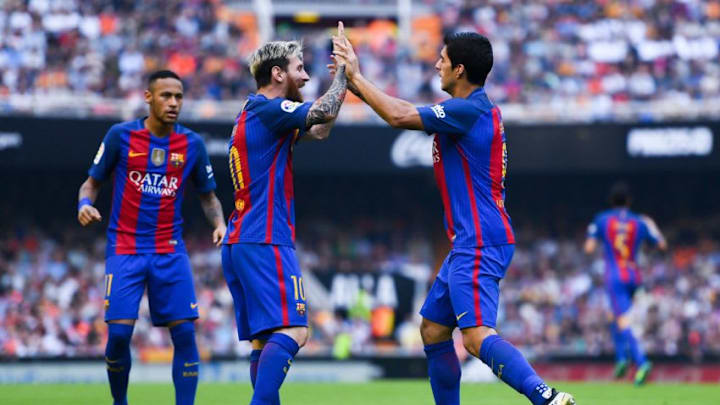 VALENCIA, SPAIN - OCTOBER 22: Luis Suarez of FC Barcelona celebrates with his team mates Neymar Jr. (L) and Lionel after scoring his team's second goal during the La Liga match between Valencia CF and FC Barcelona at Mestalla stadium on October 22, 2016 in Valencia, Spain. (Photo by David Ramos/Getty Images)