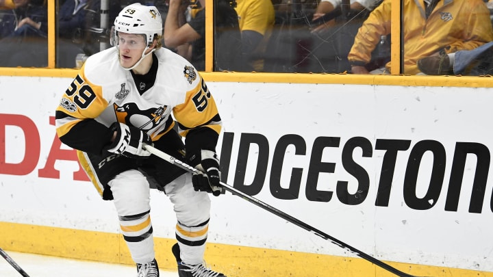 Jun 5, 2017; Nashville, TN, USA; Pittsburgh Penguins center Jake Guentzel (59) controls the puck against the Nashville Predators in the third period in game four of the 2017 Stanley Cup Final at Bridgestone Arena. Mandatory Credit: Christopher Hanewinckel-USA TODAY Sports