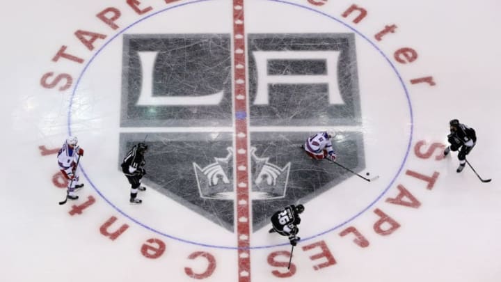 LOS ANGELES, CA - JUNE 04: The New York Rangers skate over the center ice logo against the Los Angeles Kings during Game One of the 2014 NHL Stanley Cup Final at the Staples Center on June 4, 2014 in Los Angeles, California. (Photo by Victor Decolongon/Getty Images)