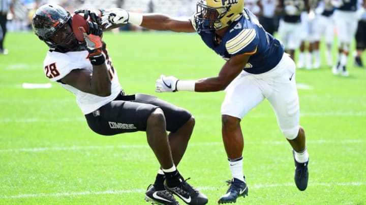 PITTSBURGH, PA - SEPTEMBER 16: James Washington #28 of the Oklahoma State Cowboys makes a catch in front of Damarri Mathis #16 of the Pittsburgh Panthers during the second quarter at Heinz Field on September 16, 2017 in Pittsburgh, Pennsylvania. (Photo by Joe Sargent/Getty Images)