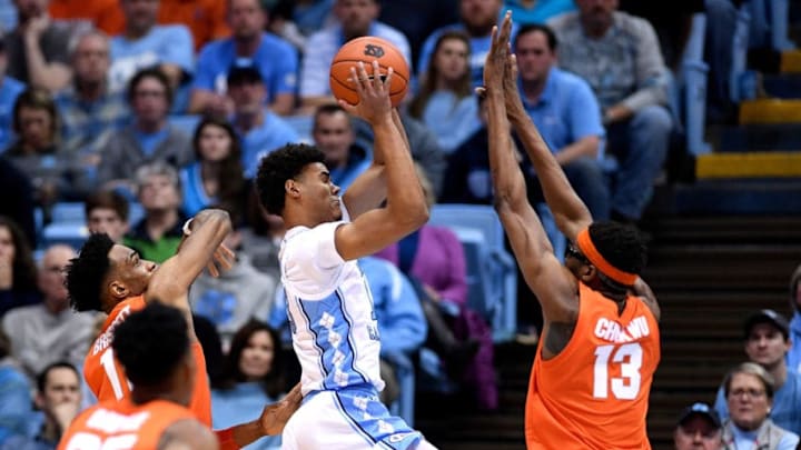 CHAPEL HILL, NORTH CAROLINA - FEBRUARY 26: Cameron Johnson #13 of the North Carolina Tar Heels shoots over Paschal Chukwu #13 of the Syracuse Orange during the first half of their game at the Dean Smith Center on February 26, 2019 in Chapel Hill, North Carolina. (Photo by Grant Halverson/Getty Images)