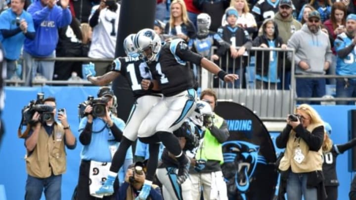 Nov 22, 2015; Charlotte, NC, USA; Carolina Panthers quarterback Cam Newton (1) celebrates a touchdown with wide receiver Ted Ginn (19) and fullback Mike Tolbert (35) in the first quarter at Bank of America Stadium. Mandatory Credit: Bob Donnan-USA TODAY Sports