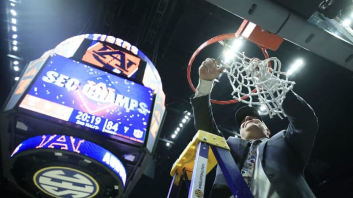 NASHVILLE, TENNESSEE - MARCH 17: Bruce Pearl of the Auburn Tigers gives cuts the net after 84-64 win over the Tennessee Volunteers during the final of the SEC Basketball Championships at Bridgestone Arena on March 17, 2019 in Nashville, Tennessee. (Photo by Andy Lyons/Getty Images)