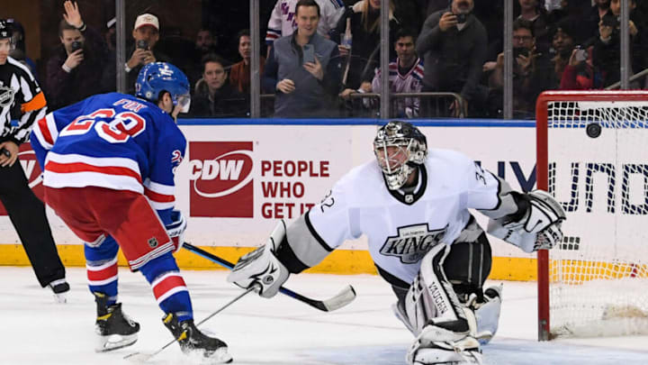 Jan 24, 2022; New York, New York, USA; New York Rangers defenseman Adam Fox (23) scores on Los Angeles Kings goaltender Jonathan Quick (32) during shootouts to win the game 3-2 at Madison Square Garden. Mandatory Credit: Dennis Schneidler-USA TODAY Sports