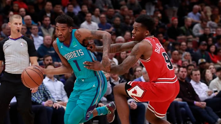 The Charlotte Hornets' Malik Monk (1) is fouled by the Chicago Bulls' Antonio Blakeney (9) during the first half at the United Center in Chicago on Wednesday, Oct. 24, 2018. The Bulls won, 112-110. (Nuccio DiNuzzo/Chicago Tribune/TNS via Getty Images)