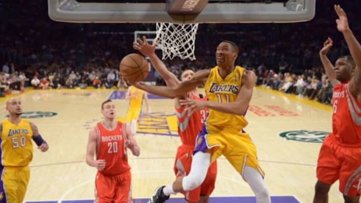 Apr 8, 2014; Los Angeles, CA, USA; Los Angeles Lakers forward Wesley Johnson (11) shoots the ball as Houston Rockets forward Donalas Motiejunas (20), forward Francisco Garcia (32) and forward Terrence Jones (6) defend at Staples Center. Mandatory Credit: Kirby Lee-USA TODAY Sports Apr 8, 2014; Los Angeles, CA, USA; Los Angeles Lakers forward Wesley Johnson (11) shoots the ball as Houston Rockets forward Donalas Motiejunas (20), forward Francisco Garcia (32) and forward Terrence Jones (6) defend at Staples Center. Mandatory Credit: Kirby Lee-USA TODAY Sports