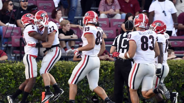 COLUMBIA, SC - OCTOBER 9: Wide receiver Terry Godwin No. 5 of the Georgia Bulldogs is congratulated by teammate tailback Brendon Douglas No. 22 after scoring a touchdown on an onside kick by the South Carolina Gamecocks during the fourth quarter on October 9, 2016 at Williams-Brice Stadium in Columbia, South Carolina. (Photo by Todd Bennett/GettyImages)