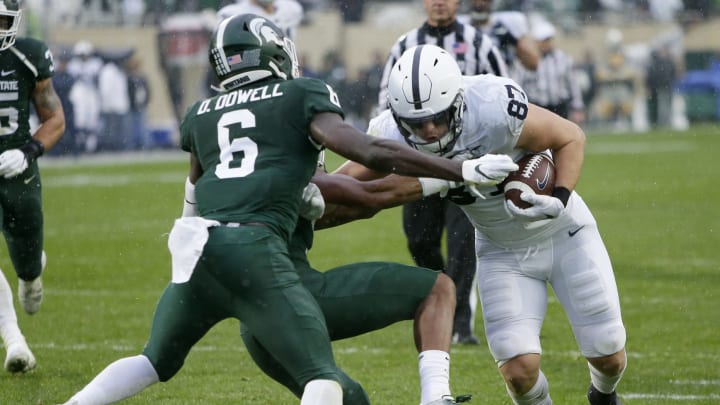 EAST LANSING, MI – OCTOBER 26: Tight end Pat Freiermuth #87 of the Penn State Nittany Lions runs for a touchdown against safety David Dowell #6 of the Michigan State Spartans during the first half at Spartan Stadium on October 26, 2019 in East Lansing, Michigan. Penn State defeated Michigan State 28-7. (Photo by Duane Burleson/Getty Images)