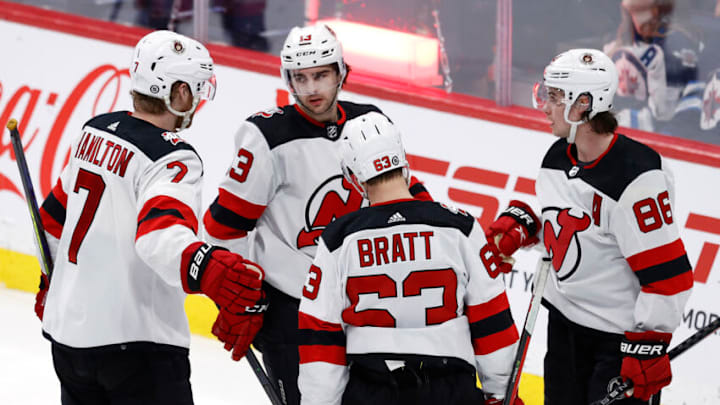 New Jersey Devils center Nico Hischier (13) celebrates his third period goal against the Winnipeg Jets at Canada Life Centre. Mandatory Credit: James Carey Lauder-USA TODAY Sports
