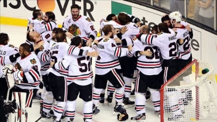 Jun 24, 2013; Boston, MA, USA; Members of the Chicago Blackhawks celebrate after defeating the Boston Bruins 3-2 in game six of the 2013 Stanley Cup Final at TD Garden. Mandatory Credit: Michael Ivins-USA TODAY Sports