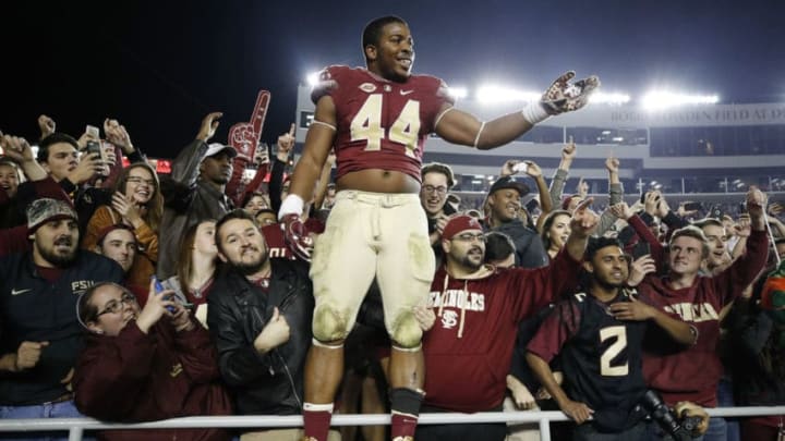 TALLAHASSEE, FL - NOVEMBER 26: DeMarcus Walker #44 of the Florida State Seminoles celebrates with fans after the game against the Florida Gators at Doak Campbell Stadium on November 26, 2016 in Tallahassee, Florida. Florida State defeated Florida 31-13. (Photo by Joe Robbins/Getty Images)