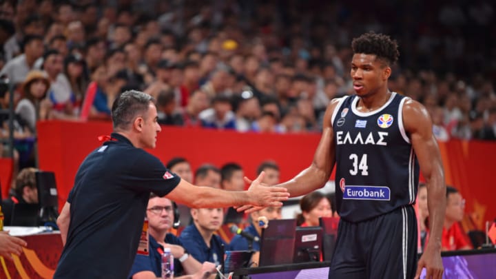 SHENZHEN, CHINA - SEPTEMBER 9: Giannis Antetokounmpo #34 of Team Greece hi-fives coach against Team Czech Republic during the FIBA World Cup on September 9, 2019 at the Shenzhen Bay Sports Center in Shenzhen, China. NOTE TO USER: User expressly acknowledges and agrees that, by downloading and/or using this photograph, user is consenting to the terms and conditions of the Getty Images License Agreement. Mandatory Copyright Notice: Copyright 2019 NBAE (Photo by David Dow/NBAE via Getty Images)