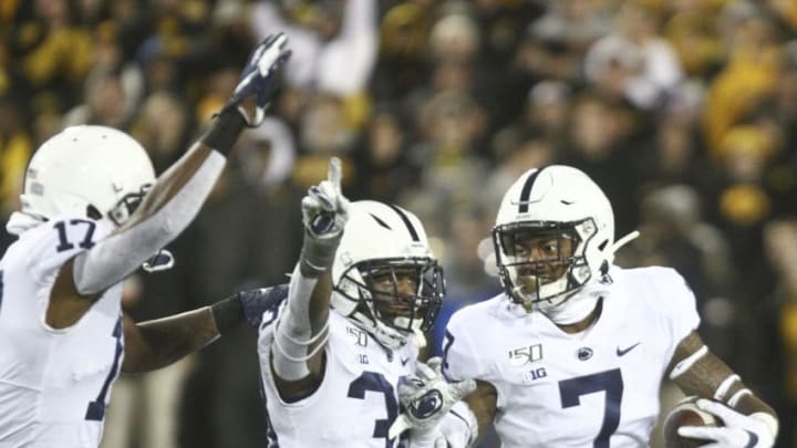 IOWA CITY, IOWA- OCTOBER 12: Safety Jaquan Brisker #7 of the Penn State Nittany Lions celebrates an interception with safeties Lamont Wade #38 and Garrett Taylor #17 in the second half against the Iowa Hawkeyes, on October 12, 2019 at Kinnick Stadium in Iowa City, Iowa. (Photo by Matthew Holst/Getty Images)