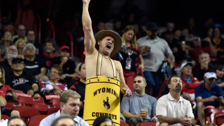 LAS VEGAS, NV - MARCH 13: Wyoming Cowboys fan Ken 'Cowboy Ken Barrel Man' Koretos of Wyoming cheers during a semifinal game of the Mountain West Conference basketball tournament against the Boise State Broncos at the Thomas