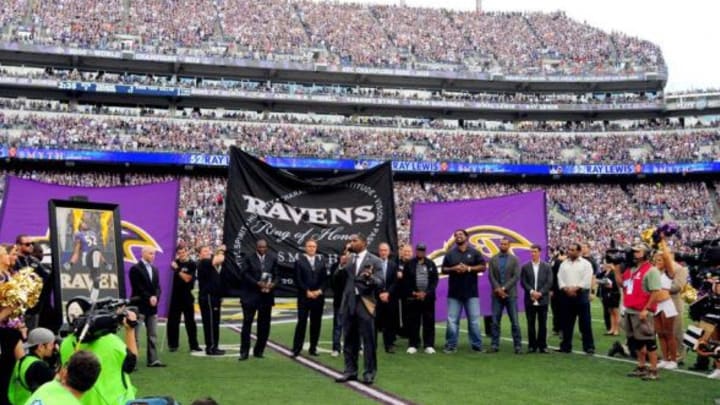 Sep 22, 2013; Baltimore, MD, USA; Former Baltimore Ravens linebacker Ray Lewis (center) speaks to the crowd while being inducted to the Ravens Ring of Honor at halftime of the game against the Houston Texans at M&T Bank Stadium. Mandatory Credit: Evan Habeeb-USA TODAY Sports