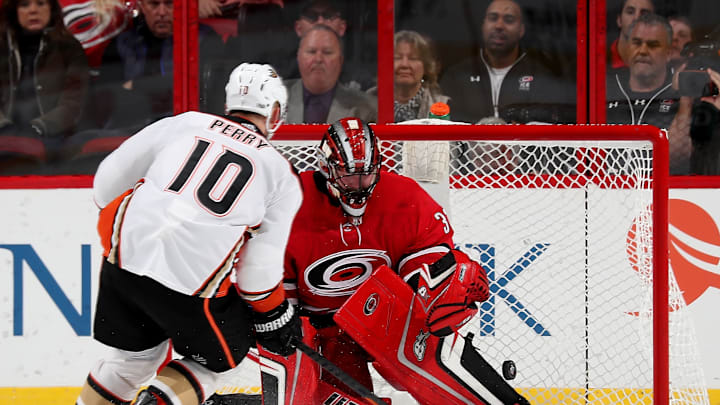 RALEIGH, NC – OCTOBER 29: Corey Perry #10 of the Anaheim Ducks scores the winning goal on Scott Darling #30 in a shootout during an NHL game on October 29, 2017 at PNC Arena in Raleigh, North Carolina. (Photo by Gregg Forwerck/NHLI via Getty Images)