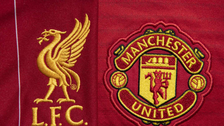 MANCHESTER, ENGLAND - MAY 04: The Liverpool and Manchester United club crests on their first team home shirts on May 4, 2020 in Manchester, England (Photo by Visionhaus)