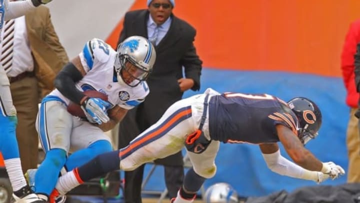 Dec 21, 2014; Chicago, IL, USA; Detroit Lions free safety Glover Quin (27) intercepts a pass intended for Chicago Bears wide receiver Alshon Jeffery (17) during the second half at Soldier Field. Detroit won 20-14. Mandatory Credit: Dennis Wierzbicki-USA TODAY Sports