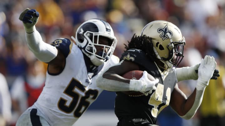 LOS ANGELES, CALIFORNIA - SEPTEMBER 15: Dante Fowler #56 of the Los Angeles Rams attempts to tackle Alvin Kamara #41 of the New Orleans Saints during the second half in the game at Los Angeles Memorial Coliseum on September 15, 2019 in Los Angeles, California. (Photo by Sean M. Haffey/Getty Images)