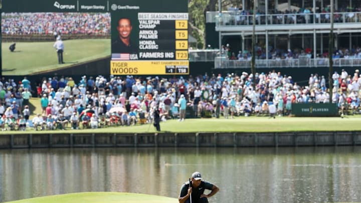 PONTE VEDRA BEACH, FL - MAY 11: Tiger Woods of the United States lines up a putt on the 17th green during the second round of THE PLAYERS Championship on the Stadium Course at TPC Sawgrass on May 11, 2018 in Ponte Vedra Beach, Florida. (Photo by Jamie Squire/Getty Images)