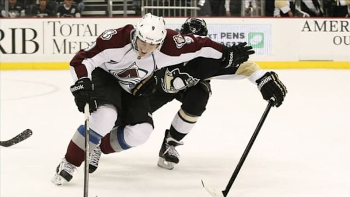 Oct 21, 2013; Pittsburgh, PA, USA; Colorado Avalanche center Matt Duchene (9) wards off Pittsburgh Penguins defenseman Matt Niskanen (2) while handling the puck during the second period at the CONSOL Energy Center. The Colorado Avalanche won 1-0. Mandatory Credit: Charles LeClaire-USA TODAY Sports