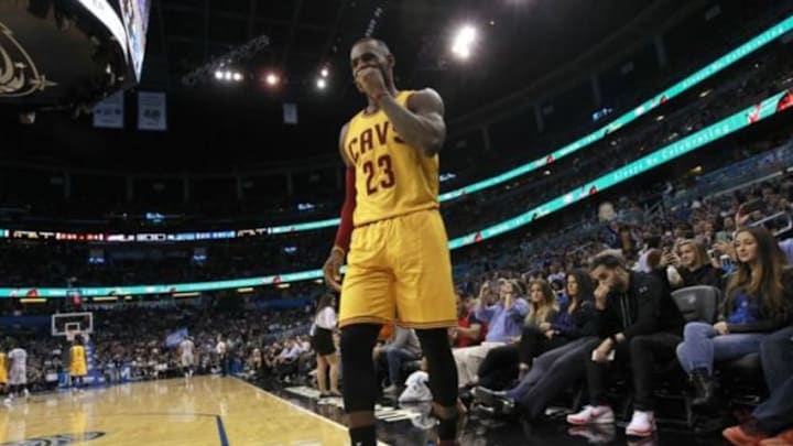 Dec 11, 2015; Orlando, FL, USA; Cleveland Cavaliers forward LeBron James (23) reacts and walks off the court after an apparent injury against the Orlando Magic during the first quarter at Amway Center. Mandatory Credit: Kim Klement-USA TODAY Sports