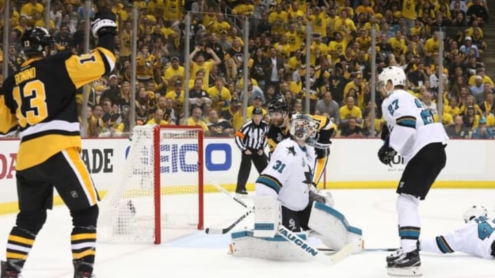 Jun 1, 2016; Pittsburgh, PA, USA; Pittsburgh Penguins center Nick Bonino (13) celebrates after assisting on a goal by right wing Phil Kessel (81) past San Jose Sharks goalie Martin Jones (31) in the second period of game two of the 2016 Stanley Cup Final at Consol Energy Center. Mandatory Credit: Charles LeClaire-USA TODAY Sports