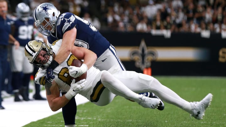 NEW ORLEANS, LOUISIANA – SEPTEMBER 29: Josh Hill #89 of the New Orleans Saintsis tackled by Sean Lee #50 of the Dallas Cowboysduring the first half of a NFL game at the Mercedes Benz Superdome on September 29, 2019 in New Orleans, Louisiana. (Photo by Sean Gardner/Getty Images)