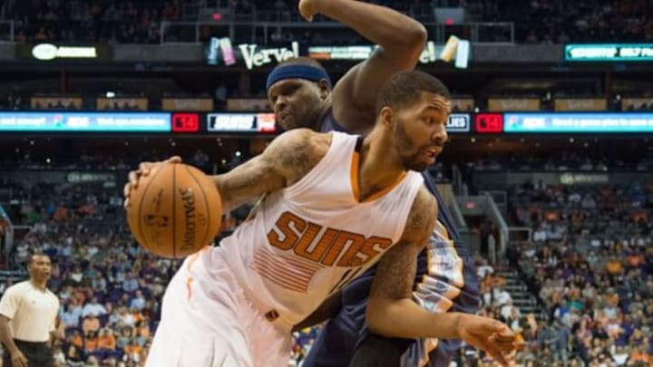 February 2, 2015; Phoenix, AZ, USA; Phoenix Suns forward Markieff Morris (11) dribbles the basketball defended by Memphis Grizzlies forward Zach Randolph (50, back) during the third quarter at US Airways Center. The Grizzlies defeated the Suns 102-101. Mandatory Credit: Kyle Terada-USA TODAY Sports