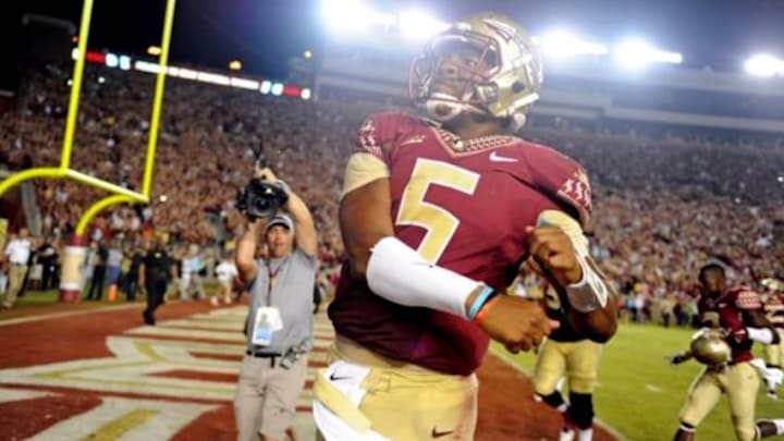Oct 18, 2014; Tallahassee, FL, USA; Florida State Seminoles quaterback Jameis Winston (5) celebrates after beating the Notre Dame Fighting Irish 31-27 at Doak Campbell Stadium. Mandatory Credit: Melina Vastola-USA TODAY Sports