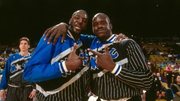 ORLANDO, FL - 1994: Tree Rollins #30 and Shaquille O'Neal #32 of the Orlando Magic pose for a photo during a game played circa 1994 at Orlando Arena in Orlando, Florida. NOTE TO USER: User expressly acknowledges and agrees that, by downloading and or using this photograph, User is consenting to the terms and conditions of the Getty Images License Agreement. Mandatory Copyright Notice: Copyright 1994 NBAE (Photo by Andrew D. Bernstein/NBAE via Getty Images)