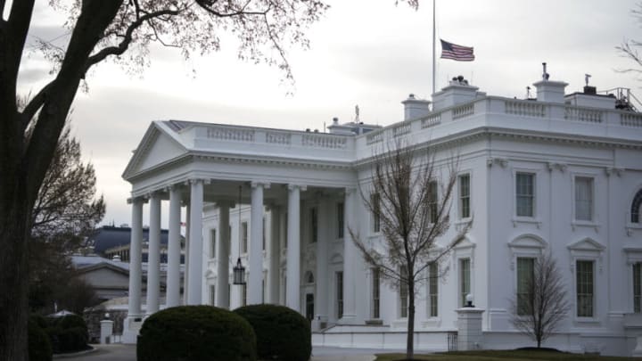 WASHINGTON, DC - MARCH 19: The American flag flies at half-staff at the White House on March 19, 2021 in Washington, DC. President Joe Biden issued a proclamation for U.S. flags on federal buildings to be lowered to half-staff through Monday to mark the recent shooting that killed eight people in Georgia. (Photo by Drew Angerer/Getty Images)