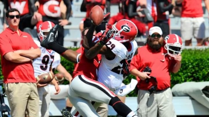 Apr 12, 2014; Athens, GA, USA; Georgia Bulldogs wide receiver Uriah LeMay (29) fights for a pass with defensive back Devin Bowman (37) during the second half of the Georgia Spring Game at Sanford Stadium. Red defeated Black 27-24. Mandatory Credit: Dale Zanine-USA TODAY Sports