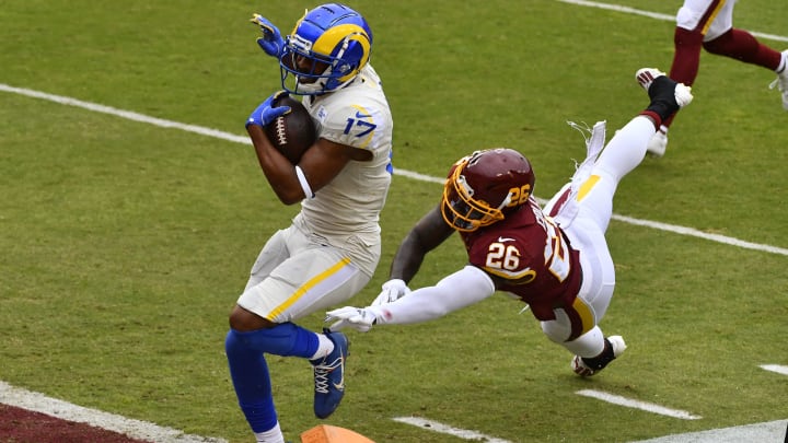 Oct 11, 2020; Landover, Maryland, USA; Los Angeles Rams wide receiver Robert Woods (17) scores a touchdown as Washington Football Team strong safety Landon Collins (26) chases during the second quarter at FedExField. Mandatory Credit: Brad Mills-USA TODAY Sports