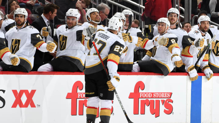 GLENDALE, ARIZONA – OCTOBER 10: Shea Theodore #27 of the Vegas Golden Knights is congratulated by teammates after scoring a goal against the Arizona Coyotes during the first period at Gila River Arena on October 10, 2019 in Glendale, Arizona. (Photo by Norm Hall/NHLI via Getty Images)