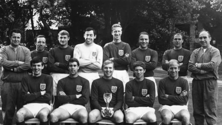 2nd November 1966: England’s triumphant World Cup winning team. With the Jules Rimet Trophy are (back row, left to right) Harold Shepherdson, Nobby Stiles, Roger Hunt, Gordon Banks, Jackie Charlton, George Cohen, Richard Wilson and manager Alf Ramsey; (front row) Martin Peters, Geoff Hurst, Bobby Moore, Alan Ball and Bobby Charlton. (Photo by Keystone/Getty Images)