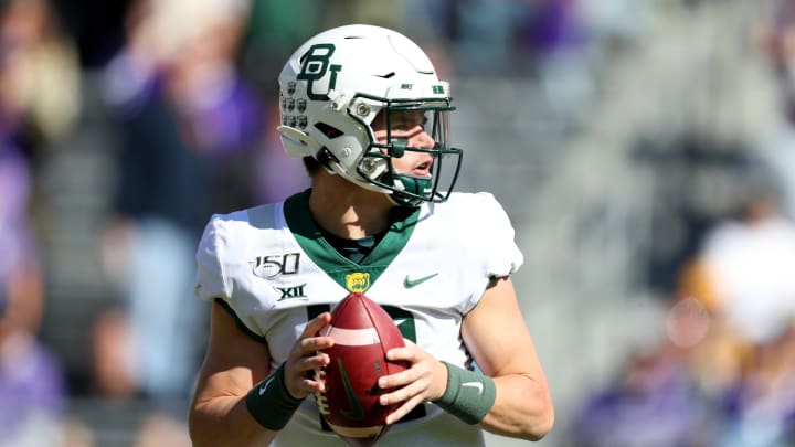 FORT WORTH, TEXAS – NOVEMBER 09: Charlie Brewer #12 of the Baylor Bears looks for an open receiver in the first quarter against the TCU Horned Frogs at Amon G. Carter Stadium on November 09, 2019 in Fort Worth, Texas. (Photo by Tom Pennington/Getty Images)