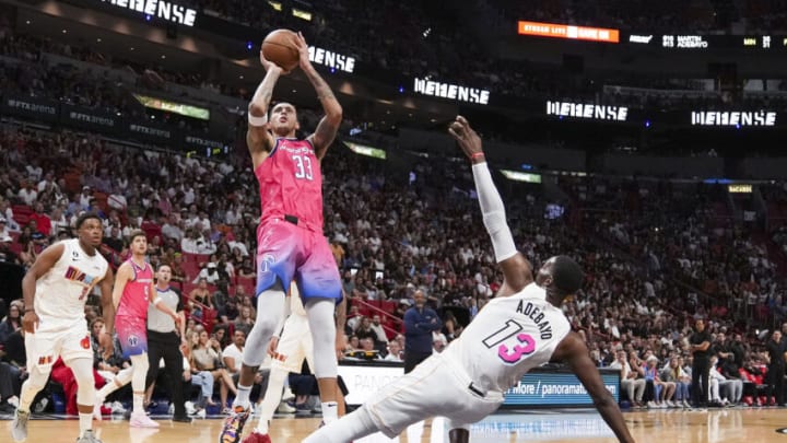 Kyle Kuzma #33 of the Washington Wizards shoots a jump shot while being defended by Bam Adebayo #13 of the Miami Heat (Photo by Eric Espada/Getty Images)