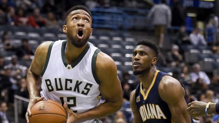 Nov 3, 2016; Milwaukee, WI, USA; Milwaukee Bucks forward Jabari Parker (12) looks for a shot against Indiana Pacers forward Thaddeus Young (21) in the third quarter at BMO Harris Bradley Center. Parker scored 27 points as the Bucks beat the Pacers 125-107. Mandatory Credit: Benny Sieu-USA TODAY Sports