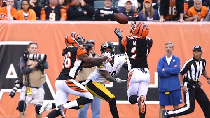 Dec 13, 2015; Cincinnati, OH, USA; Cincinnati Bengals free safety Reggie Nelson (20) intercepts a pass intended for Pittsburgh Steelers wide receiver Martavis Bryant (10) in the second half at Paul Brown Stadium. The Steelers won 33-20. Mandatory Credit: Aaron Doster-USA TODAY Sports