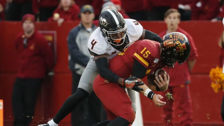 AMES, IA – OCTOBER 26: Cornerback A.J. Green #4 of the Oklahoma State Cowboys tackles quarterback Brock Purdy #15 of the Iowa State Cyclones as he scrambled for yards in the second half of play at Jack Trice Stadium on October 26, 2019 in Ames, Iowa. The Oklahoma State Cowboys won 34-27 over the Iowa State Cyclones.(Photo by David Purdy/Getty Images)