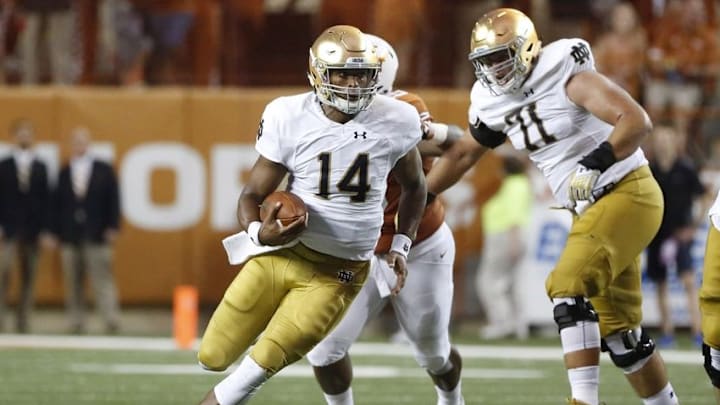 Sep 4, 2016; Austin, TX, USA; Notre Dame Fighting Irish quarterback DeShone Kizer (14) runs the ball against the Texas Longhorns at Darrell K Royal-Texas Memorial Stadium. Mandatory Credit: Soobum Im-USA TODAY Sports